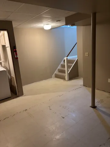 a view of an empty room with stairs