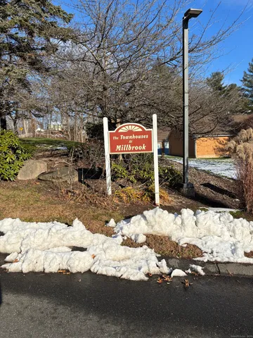 a street sign on a road next to a road