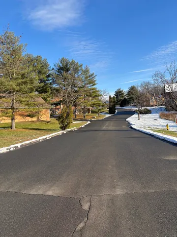 a view of a street with an ocean view