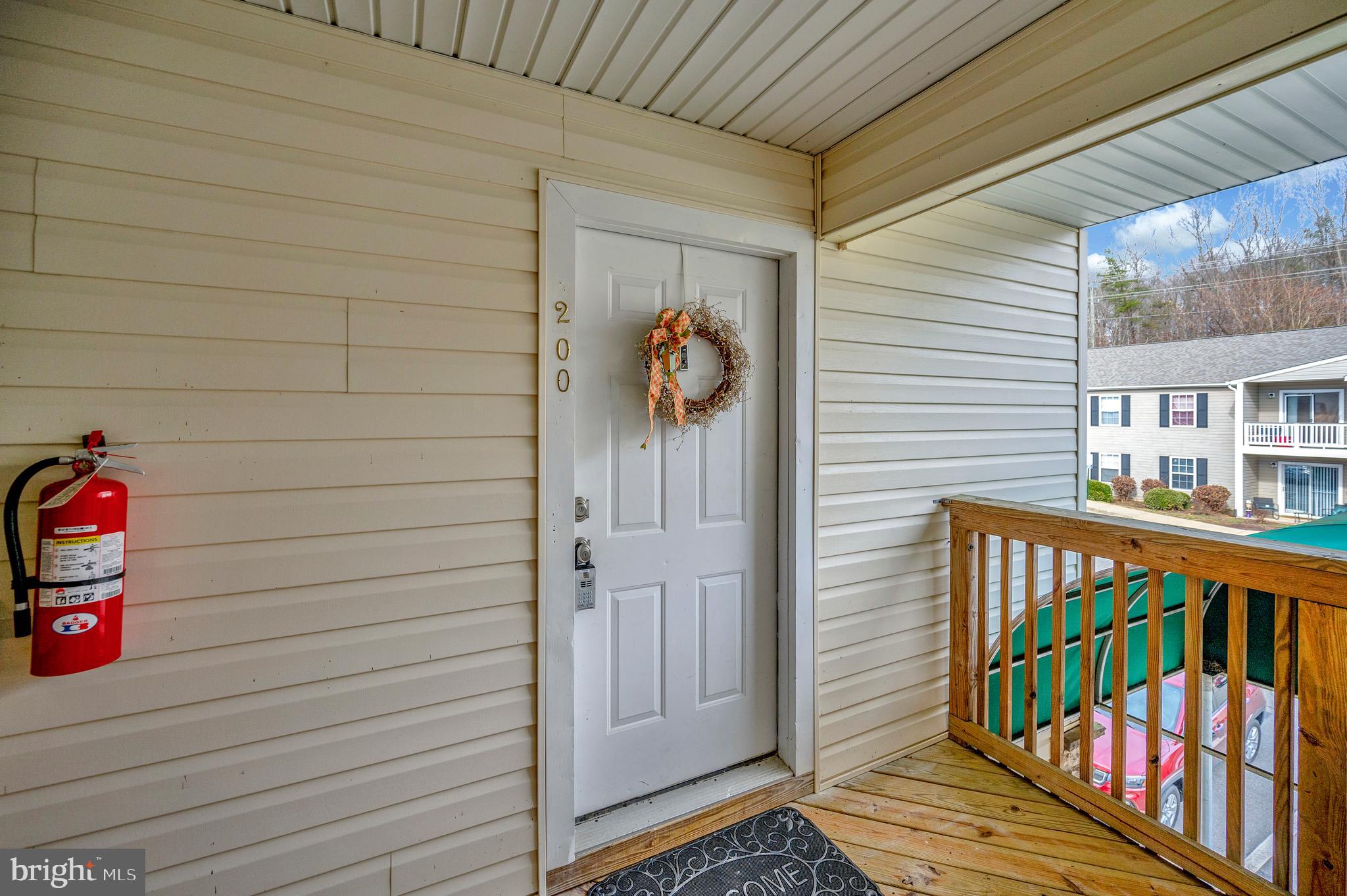 a view of a house with a wooden deck