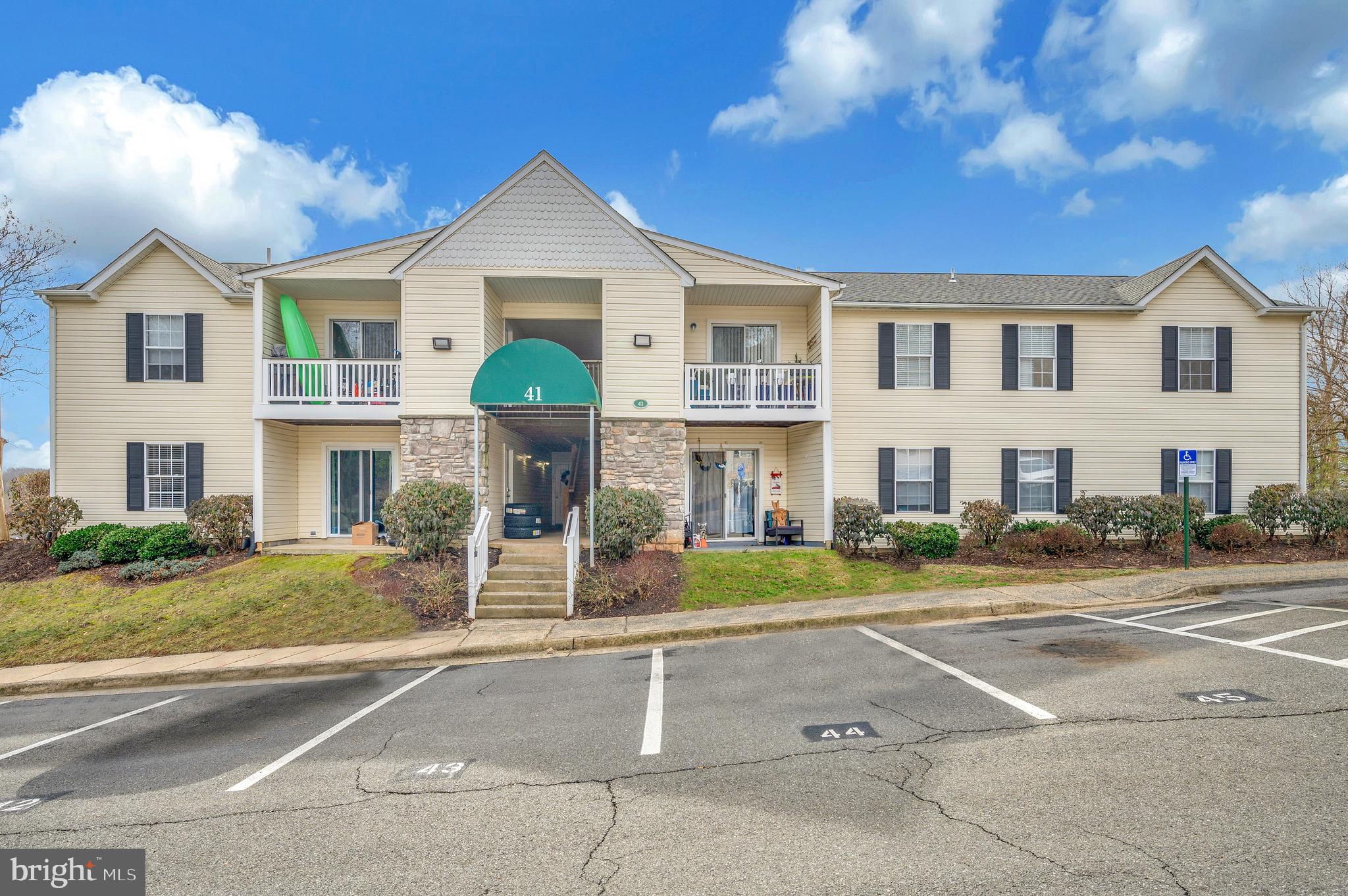 41 Smokewood Court, Unit 200 Stafford, VA 22554 - Photo 34 of 40 a front view of a house with a yard