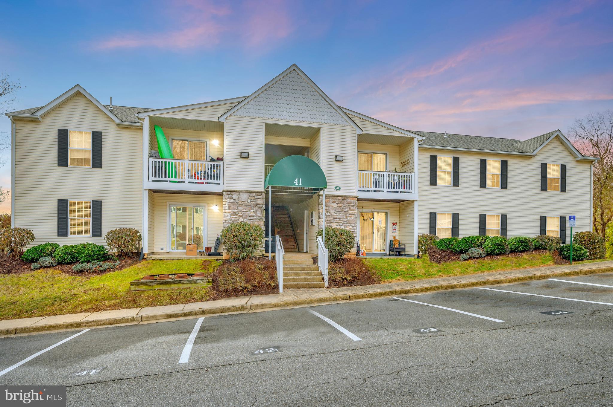 41 Smokewood Court, Unit 200 Stafford, VA 22554 - Photo 36 of 40 a front view of a house with a yard