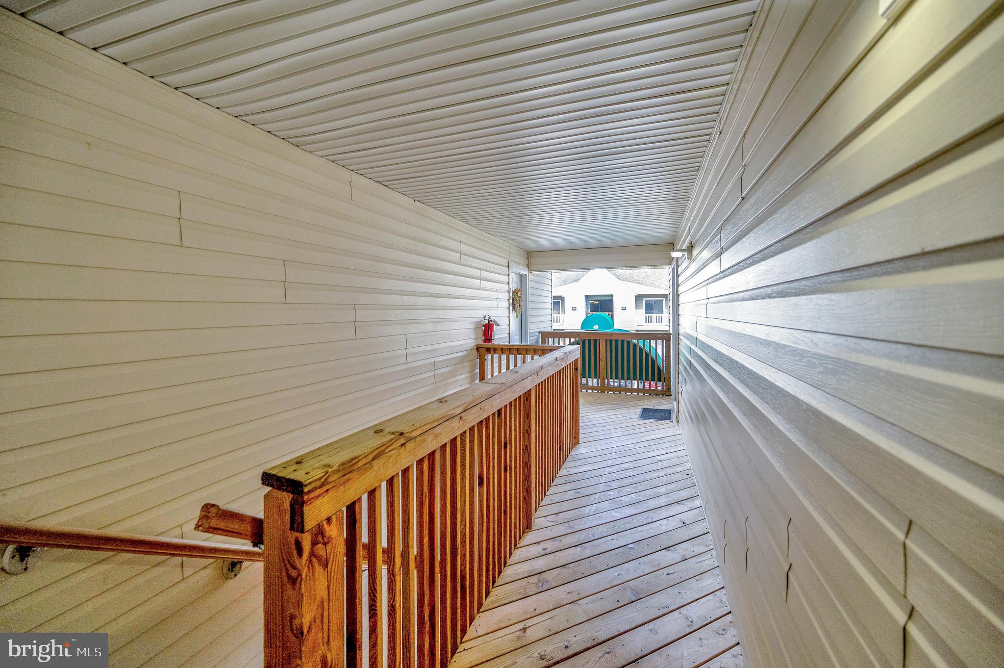 41 Smokewood Court, Unit 200 Stafford, VA 22554 - Photo 40 of 40 a view of a balcony with wooden floor