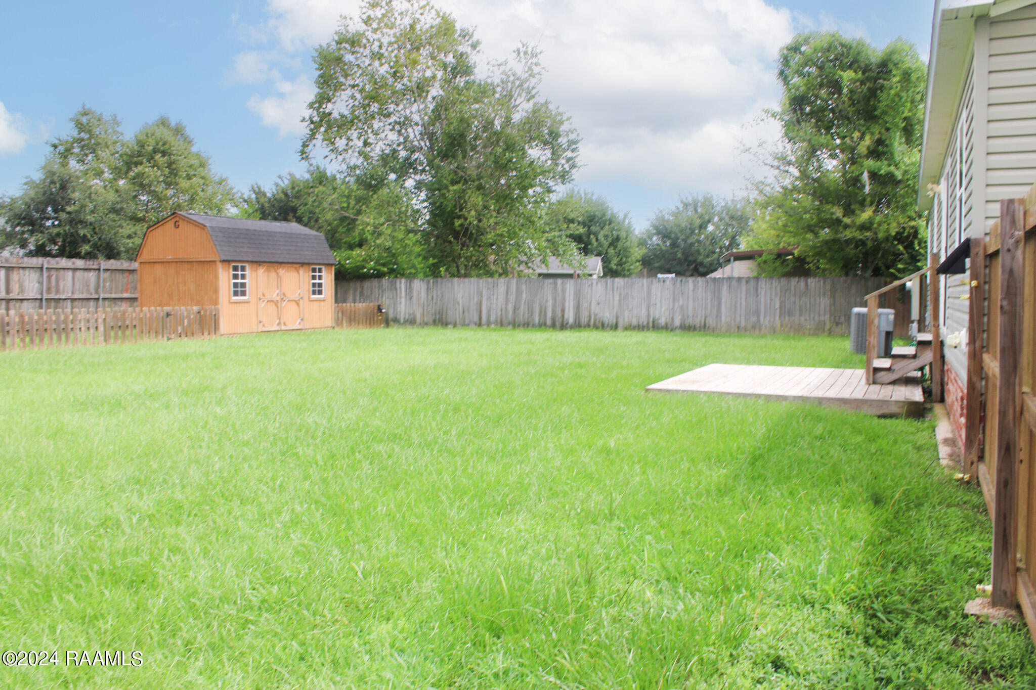 113 Squirrel Youngsville, LA 70592 - Photo 18 of 19 Backyard view from side