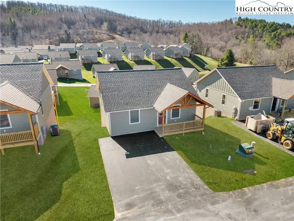 an aerial view of a house with a garden
