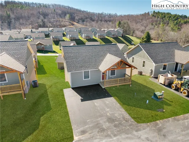 an aerial view of a house with a garden