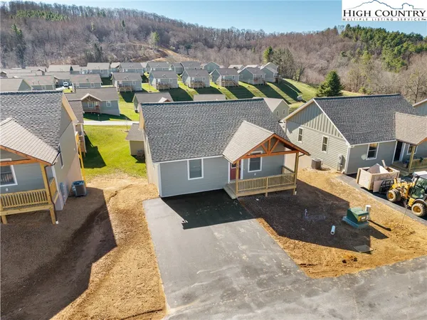 an aerial view of a house with a garden