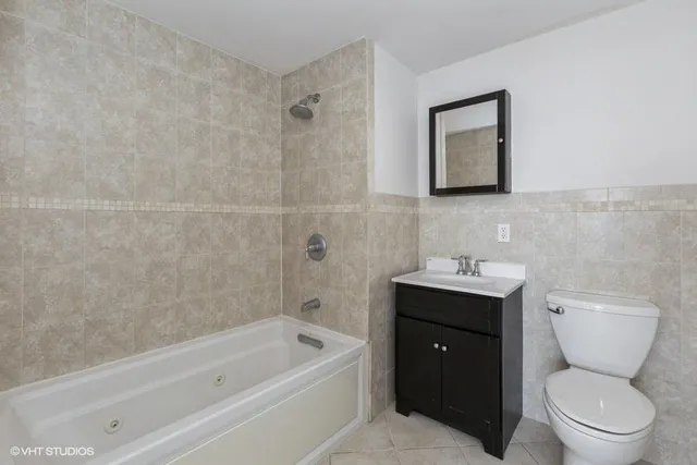 a bathroom with a toilet sink and bathtub