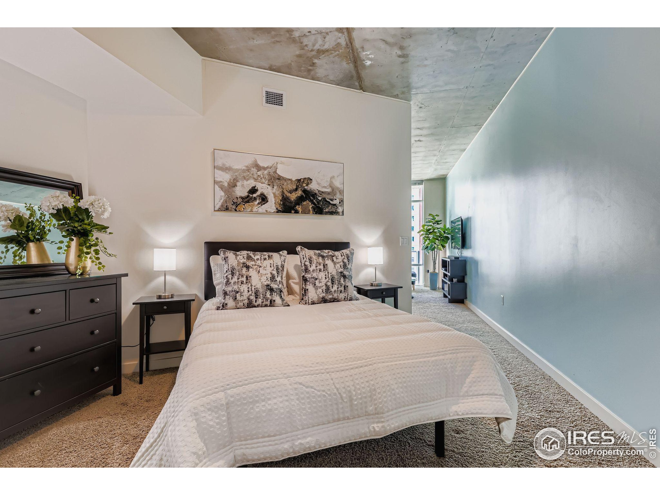 891 14th Street, Unit 1111 Denver, CO 80202 - Photo 11 of 38 a bedroom with a bed and a table