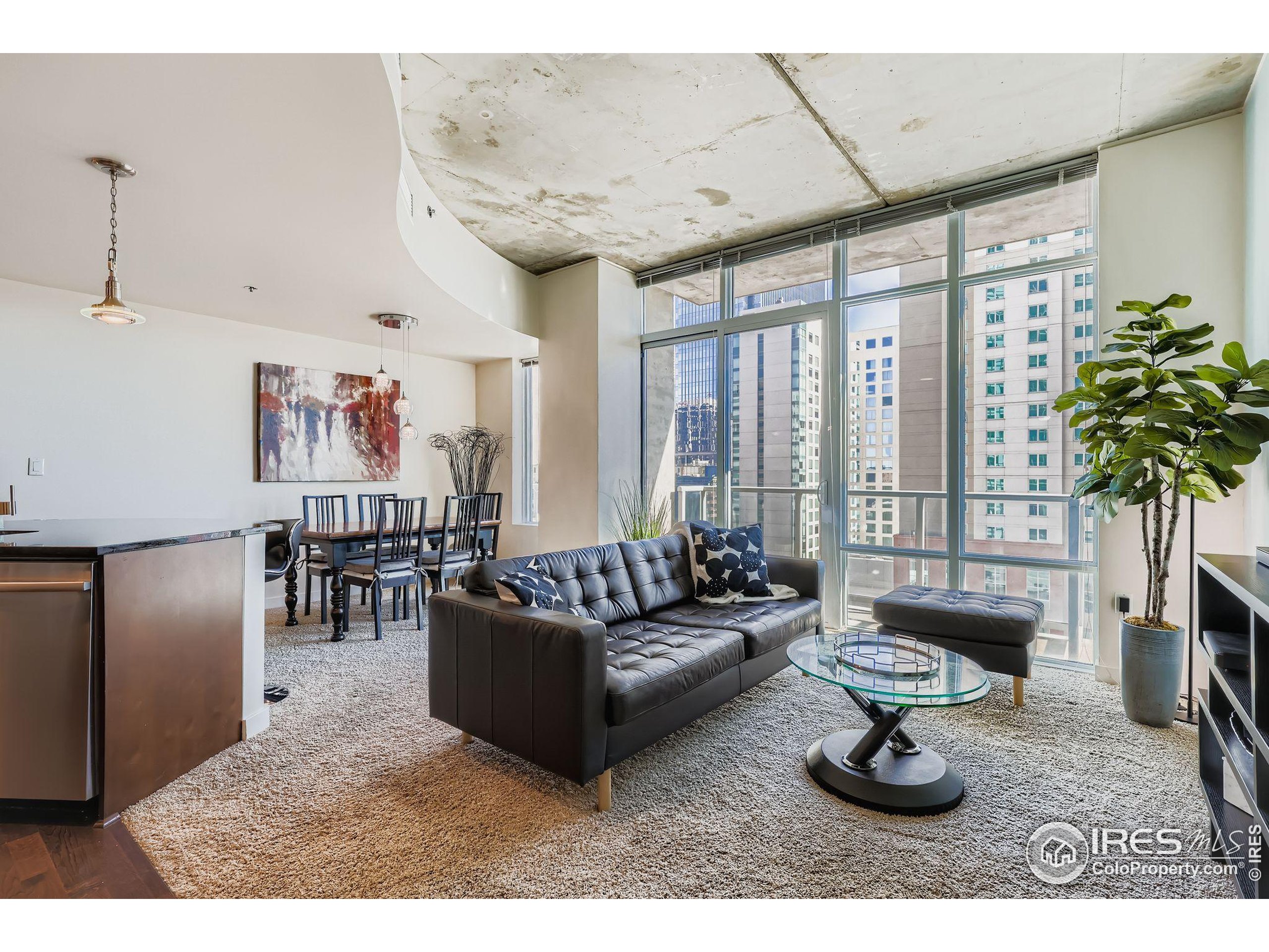 891 14th Street, Unit 1111 Denver, CO 80202 - Photo 2 of 38 a living room with furniture and a potted plant