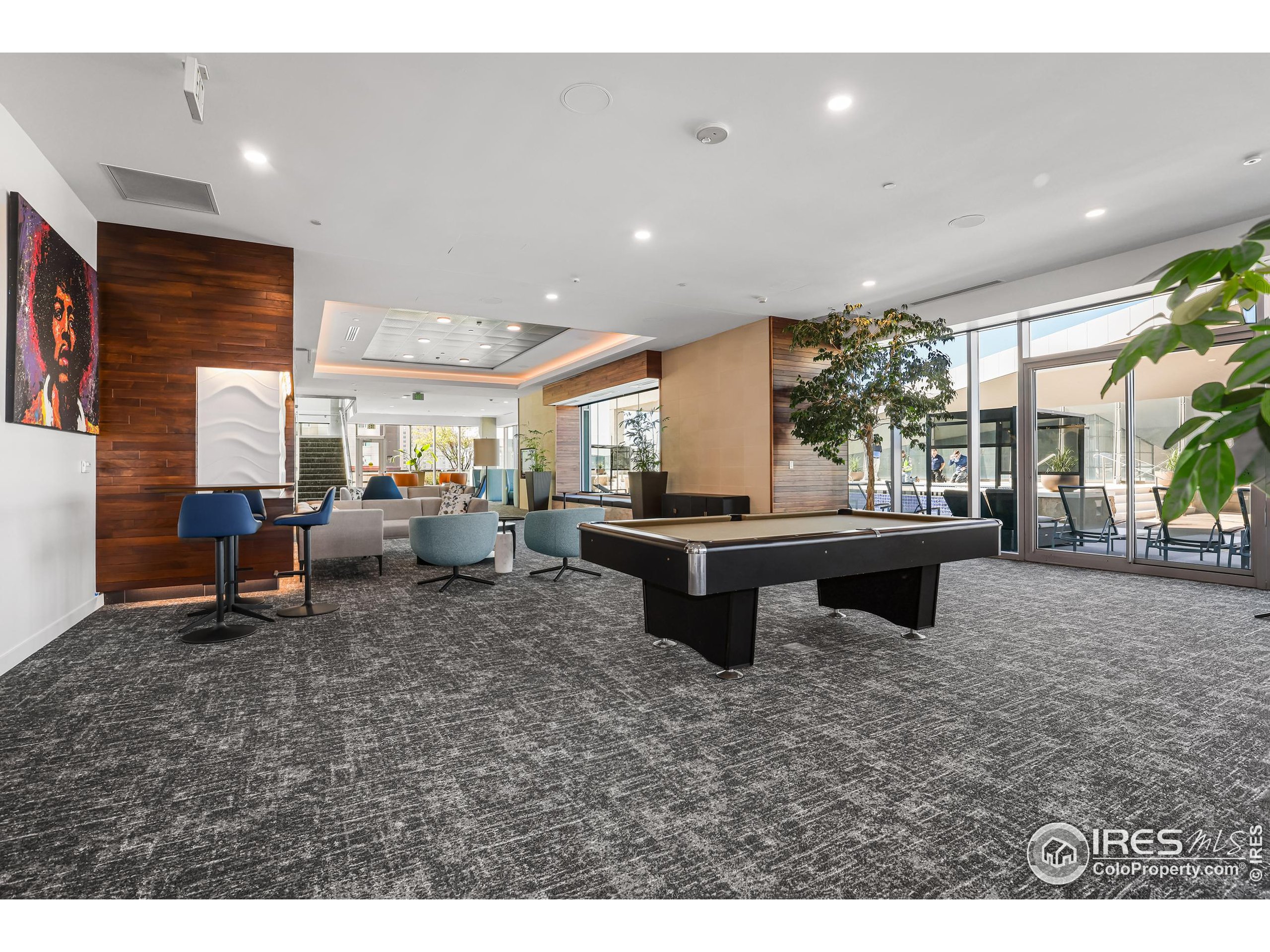 891 14th Street, Unit 1111 Denver, CO 80202 - Photo 22 of 38 a living room with furniture a pool table and a fireplace
