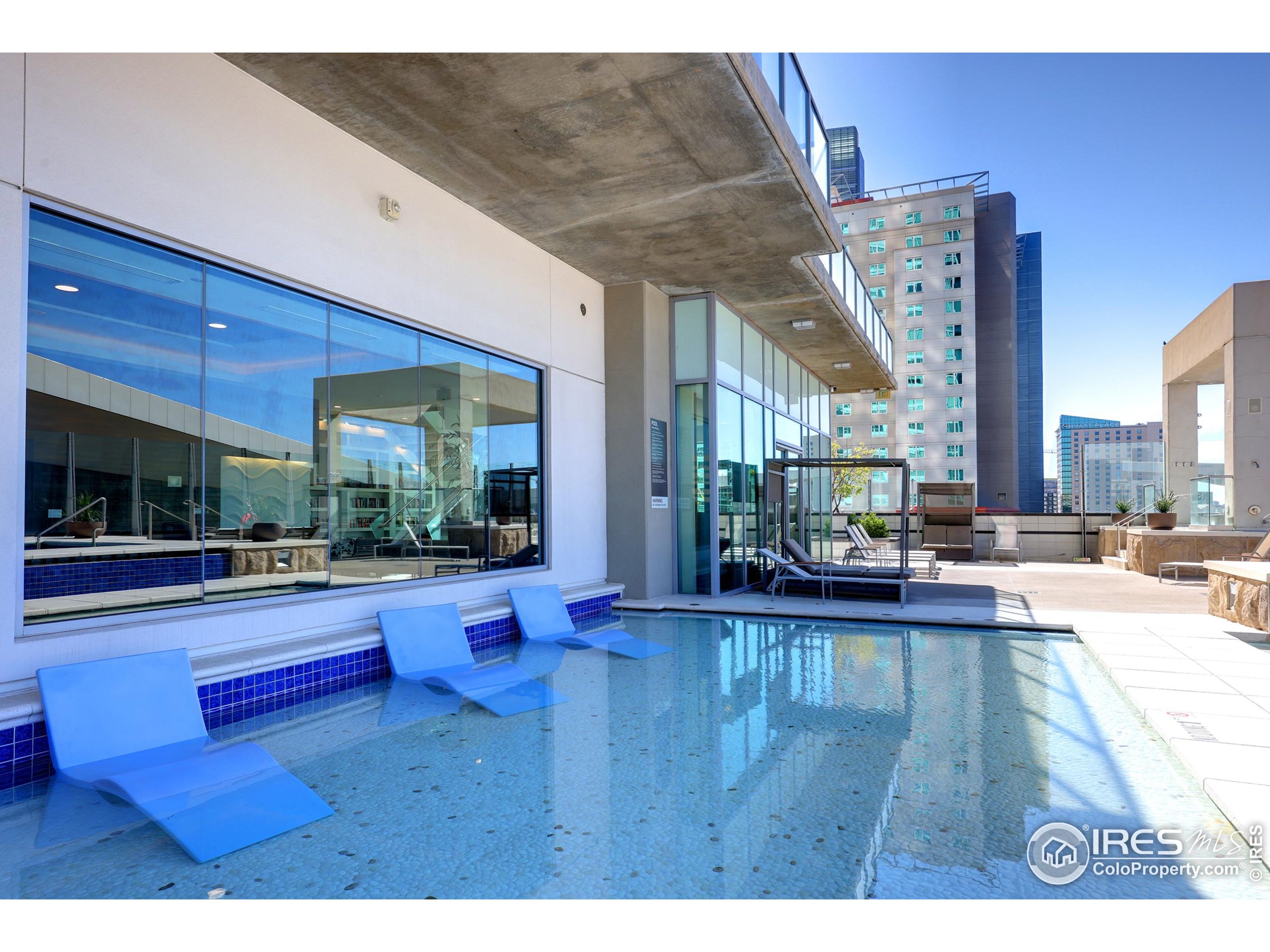 891 14th Street, Unit 1111 Denver, CO 80202 - Photo 34 of 38 a view of a living room and kitchen floor to ceiling windows