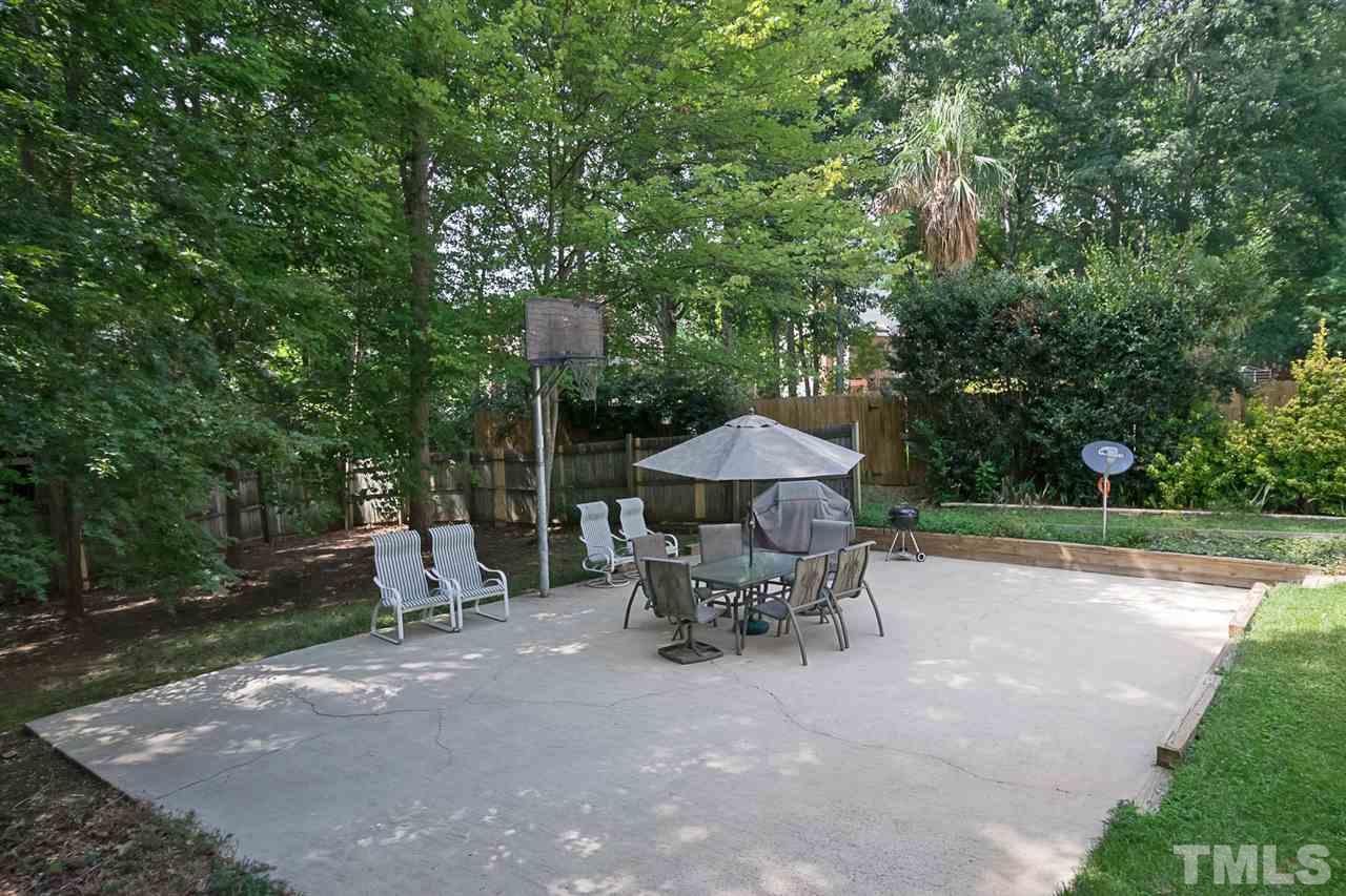 7905 Rooksley Court Raleigh, NC 27615 - Photo 22 of 24 a view of a outdoor space with a patio and sitting area