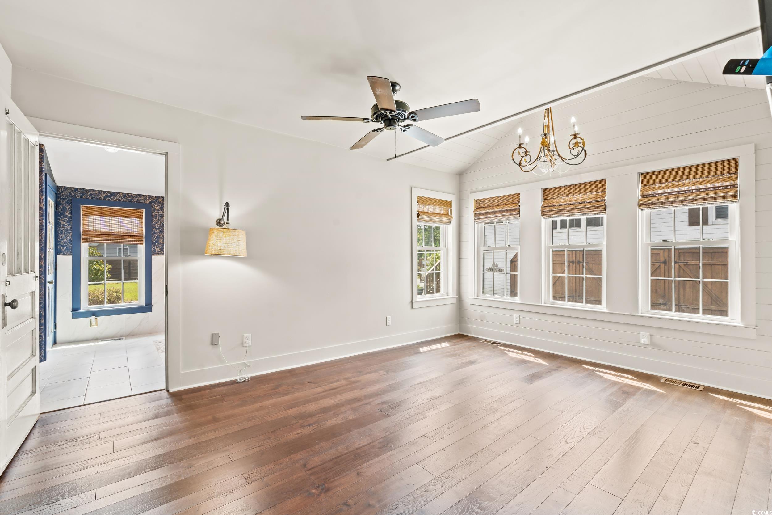 4842 Main Street Loris, SC 29569 - Photo 10 of 40 Empty room with lofted ceiling, ceiling fan with n