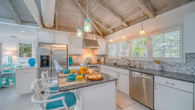 a kitchen with lots of counter top space and living room