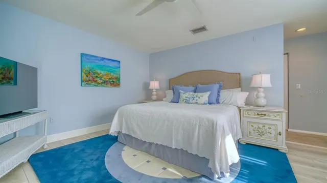 a bedroom with a bed and a workspace