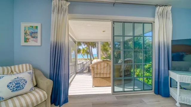 a living room with a couch and a large window