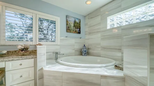 a bedroom with a bed and a table