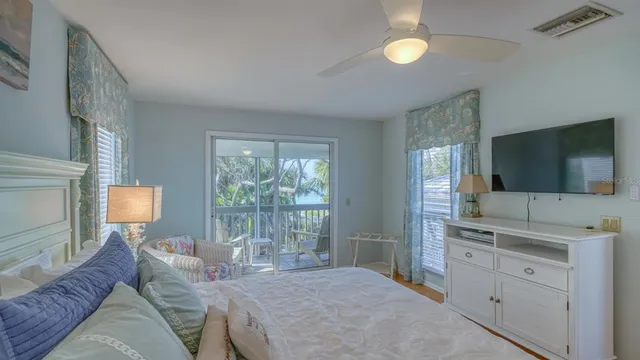 a view of a hallway with wooden floor and entryway