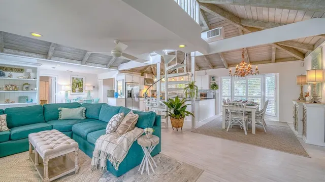a dining room with furniture and a chandelier