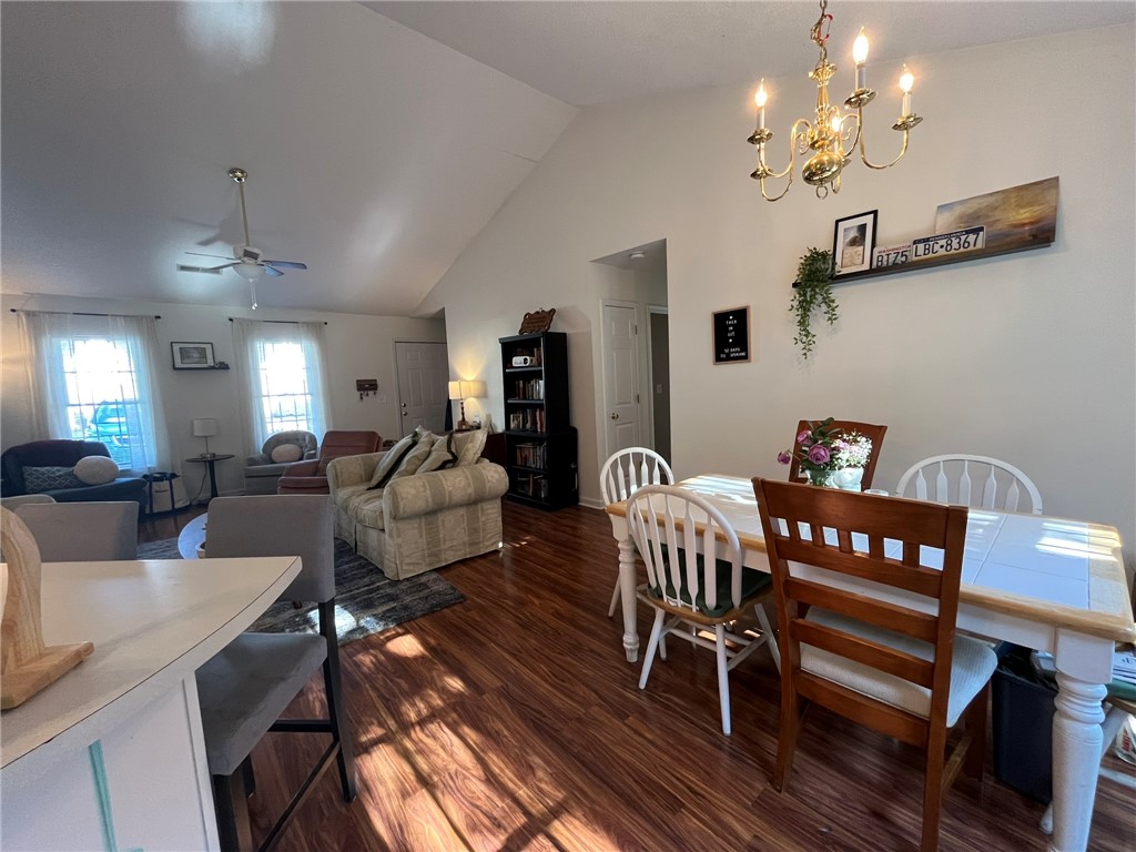 116 Arbors Court Central, SC 29630 - Photo 12 of 27 Natural light illuminates rich hardwood flooring throughout this inviting open-concept living and dining area.