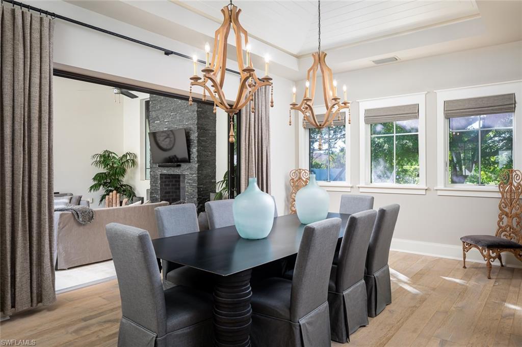 3170 Crayton Road Naples, FL 34103 - Photo 15 of 50 a view of a dining room with furniture window and outside view
