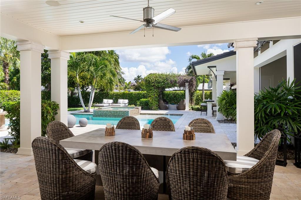 3170 Crayton Road Naples, FL 34103 - Photo 16 of 50 a view of an outside dining space with furniture window and outside view