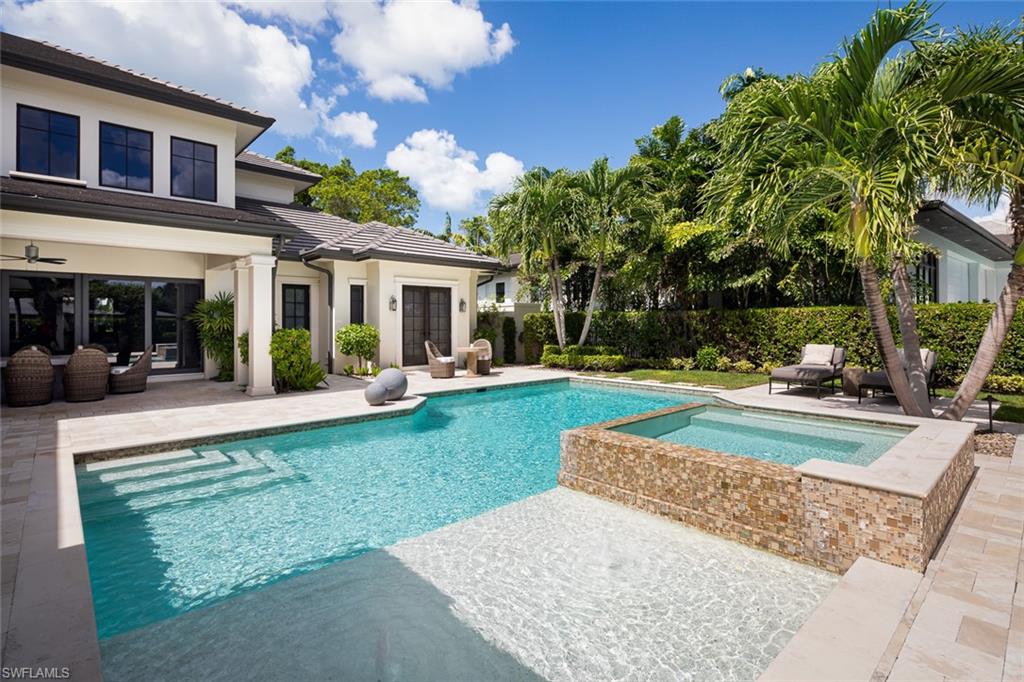 3170 Crayton Road Naples, FL 34103 - Photo 24 of 50 front view of a house with a yard