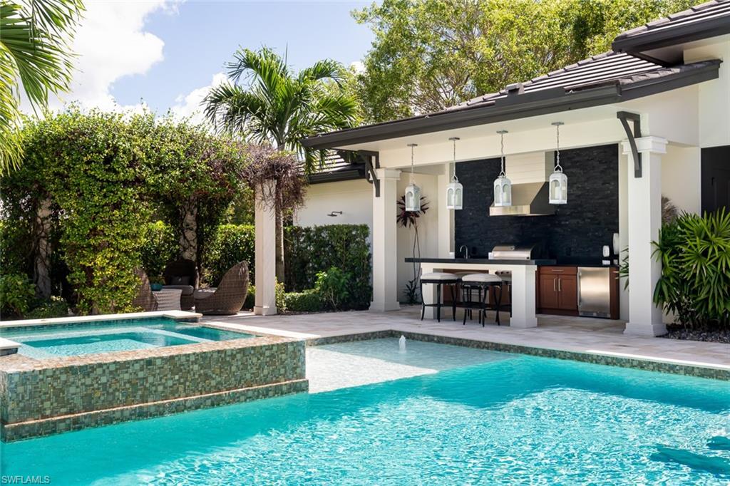 3170 Crayton Road Naples, FL 34103 - Photo 25 of 50 a view of a house with backyard porch and sitting area