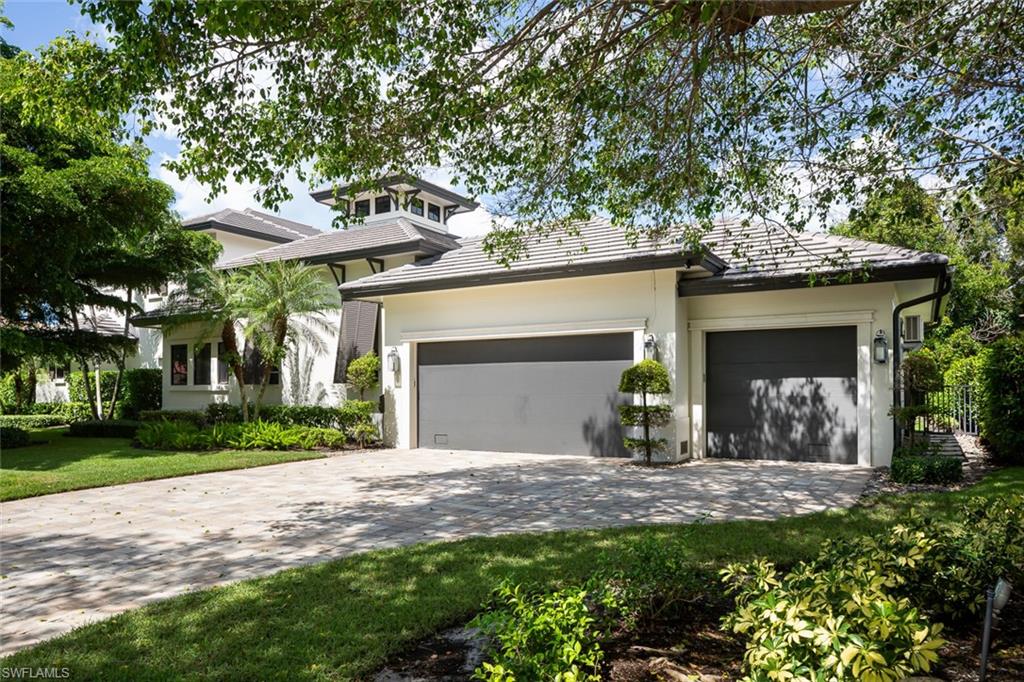 3170 Crayton Road Naples, FL 34103 - Photo 39 of 50 front view of a house with a yard