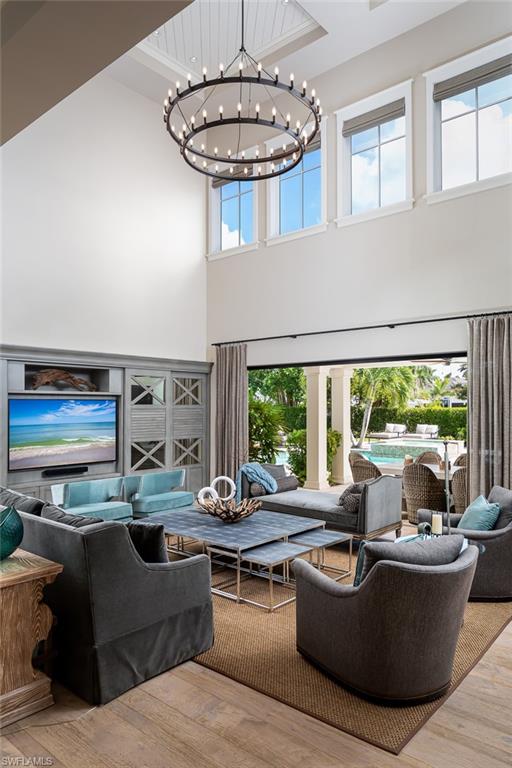3170 Crayton Road Naples, FL 34103 - Photo 4 of 50 a living room with furniture and a large window