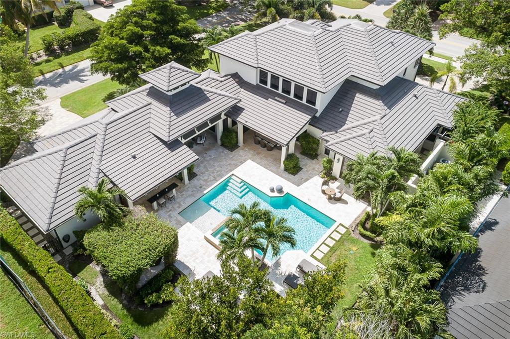 3170 Crayton Road Naples, FL 34103 - Photo 41 of 50 an aerial view of a house with a yard and outdoor seating