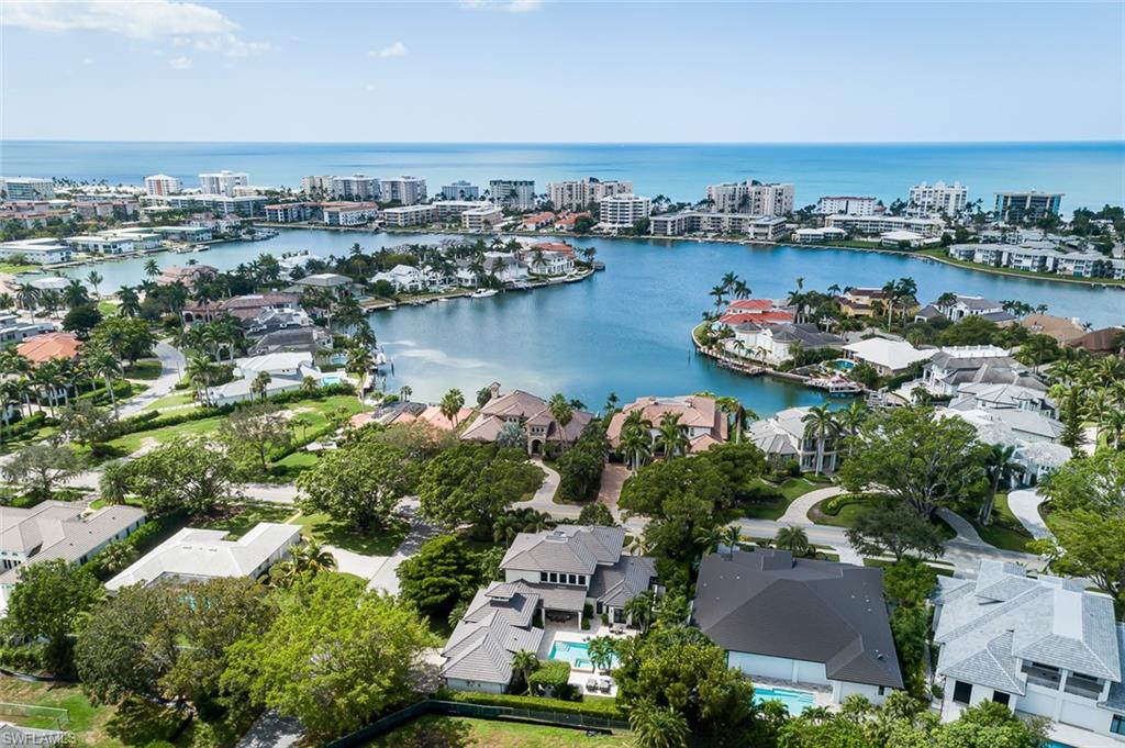 3170 Crayton Road Naples, FL 34103 - Photo 43 of 50 an aerial view of a city with lake view