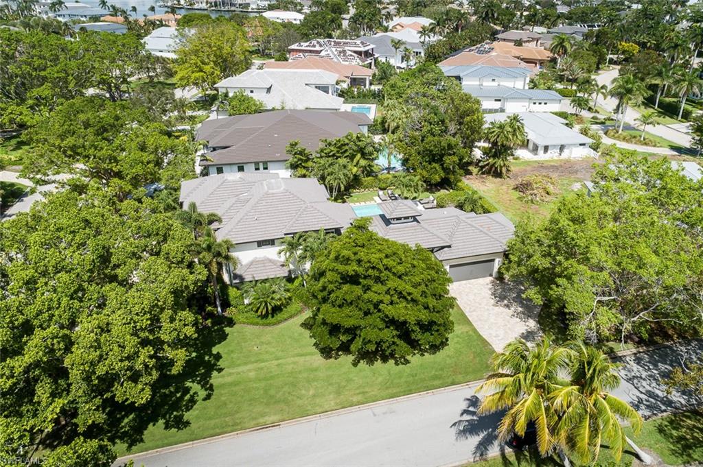 3170 Crayton Road Naples, FL 34103 - Photo 47 of 50 an aerial view of residential house with outdoor space and trees all around