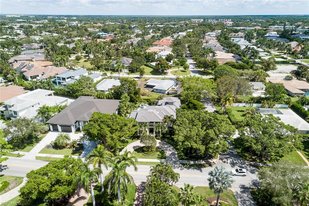 3170 Crayton Road Naples, FL 34103 - Photo 48 of 50 an aerial view of residential houses with outdoor space and trees