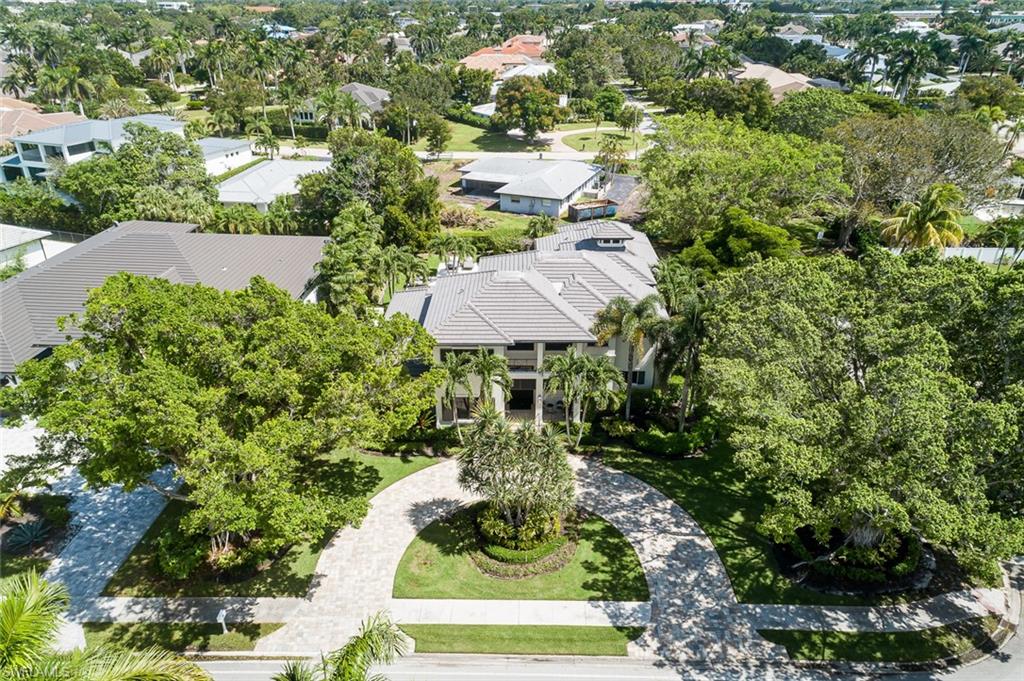 3170 Crayton Road Naples, FL 34103 - Photo 49 of 50 a view of a garden with an umbrella