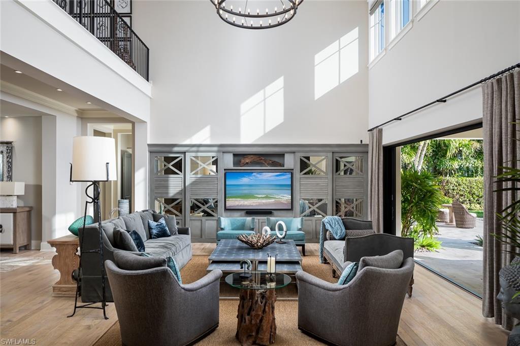 3170 Crayton Road Naples, FL 34103 - Photo 5 of 50 a living room with furniture and a large window