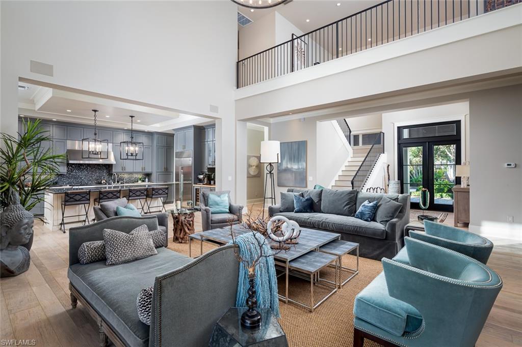 3170 Crayton Road Naples, FL 34103 - Photo 6 of 50 a living room with furniture and a large window