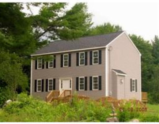 33 Bond Road Charlton, MA 01507 - Photo 1 of 6 a aerial view of a house next to a yard