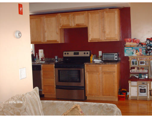 33 Bond Road Charlton, MA 01507 - Photo 4 of 6 a kitchen with stainless steel appliances granite countertop a stove a sink and a microwave