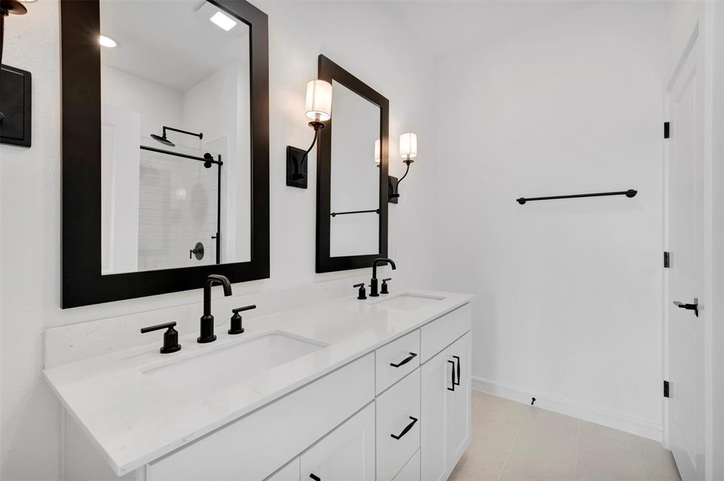 175 Summer Rain Way Newark, TX 76071 - Photo 12 of 39 a bathroom with double vanity sink and two mirror
