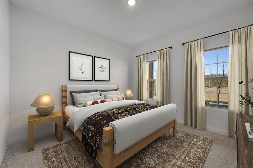 175 Summer Rain Way Newark, TX 76071 - Photo 14 of 39 a bedroom with a bed lamps and a large mirror on dresser