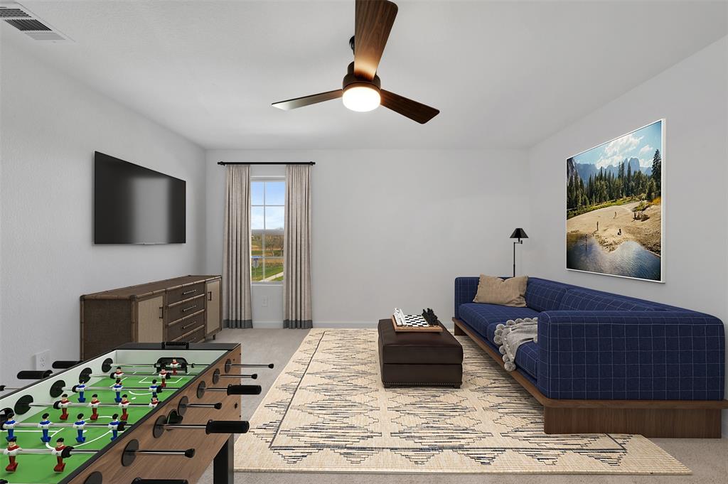 175 Summer Rain Way Newark, TX 76071 - Photo 18 of 39 a living room with furniture and a flat screen tv