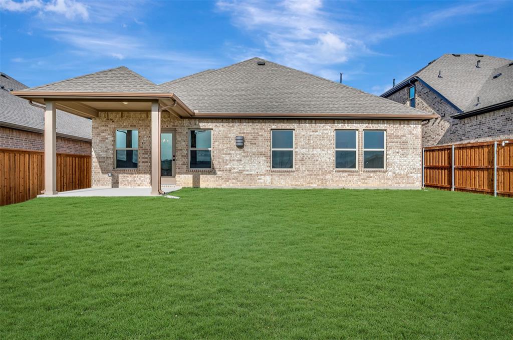 175 Summer Rain Way Newark, TX 76071 - Photo 25 of 39 a front view of a house with garden