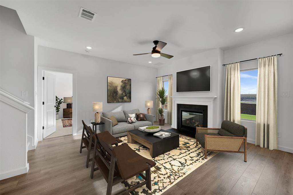 175 Summer Rain Way Newark, TX 76071 - Photo 3 of 39 a living room with furniture fireplace and a flat screen tv