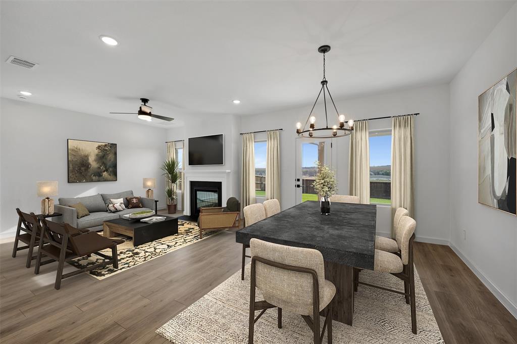 175 Summer Rain Way Newark, TX 76071 - Photo 7 of 39 a view of a a dining room with furniture window and wooden floor