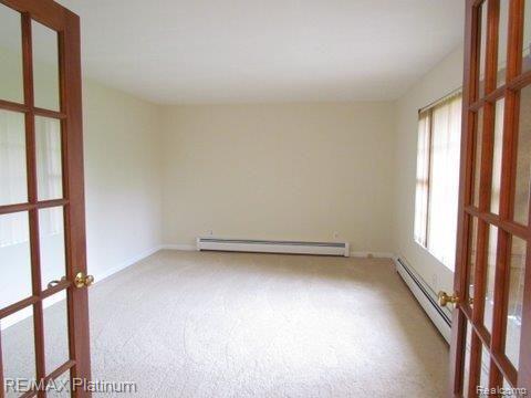 4647 North Eager Road Howell, MI 48855 - Photo 10 of 25 French Doors to Living Rm