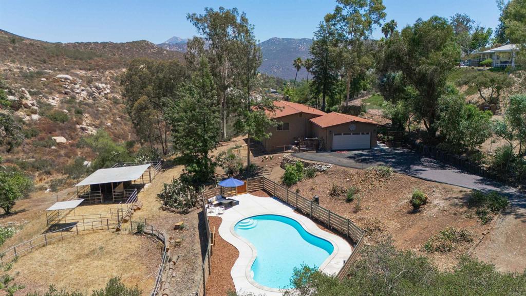 12063 Rocoso Road Lakeside, CA 92040 - Photo 1 of 1 an aerial view of a house with a yard and trees