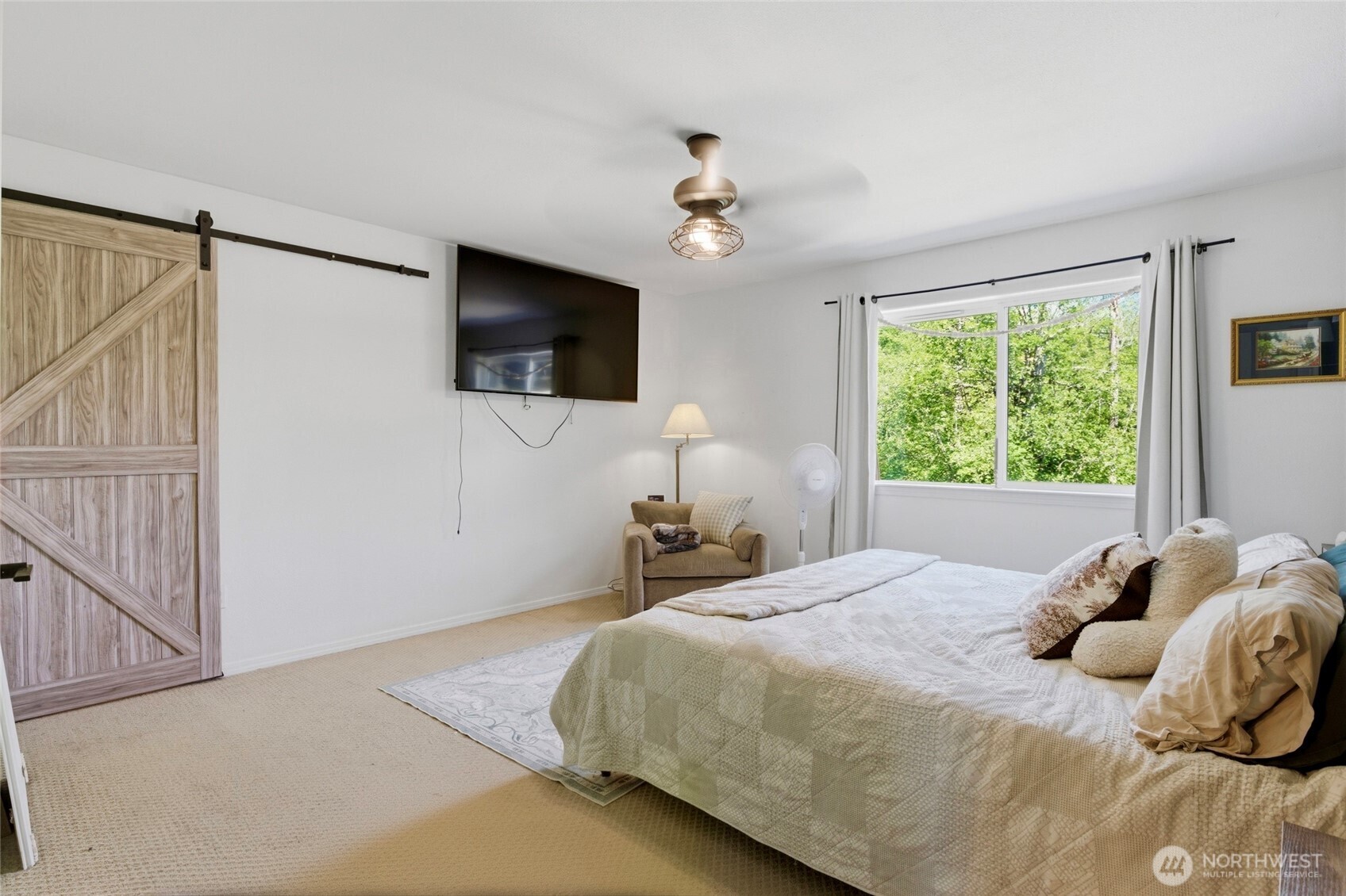 14005 Cedar Court Sultan, WA 98294 - Photo 26 of 38 a bedroom with a bed and a flat screen tv