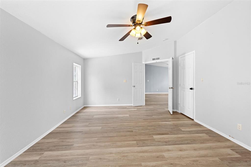 33320 Larkin Road Dade City, FL 33523 - Photo 30 of 60 wooden floor in an empty room with a window